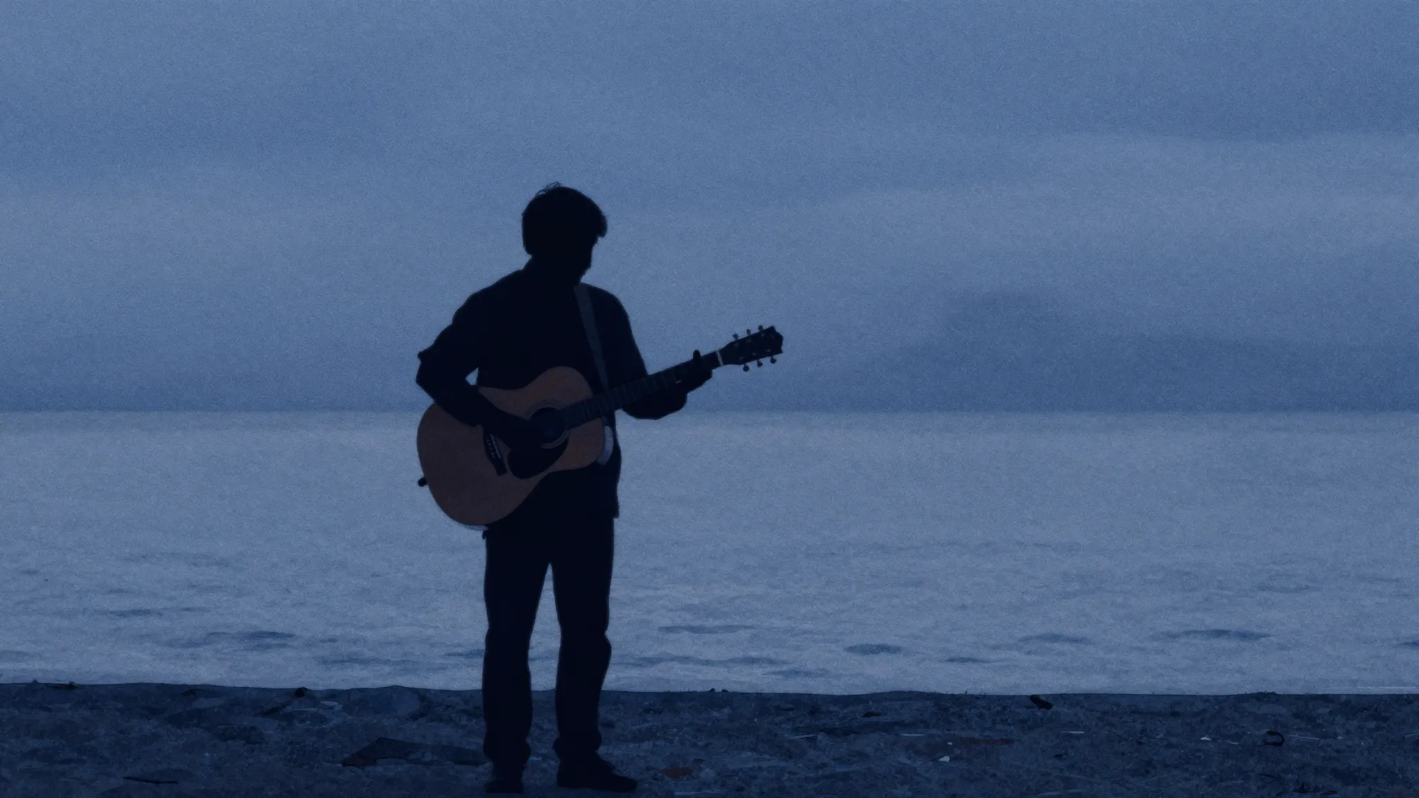 Watercolor style. A silhouette of a man playing a guitar by ...