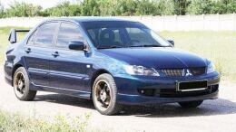 Накладка на передний бампер (юбка) Mitsubishi Lancer 9, тюнинг "Sport 2.0" (штатный-заводской обвес Спорт 2.0)