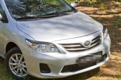 Накладки на передние фары (реснички) Toyota Corolla (седан) 2010-2013