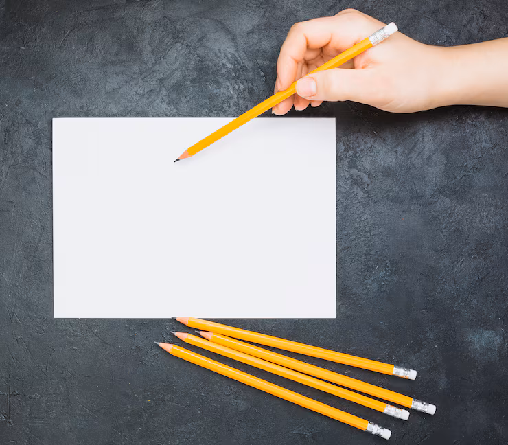 hand-sketching-blank-white-paper-with-pencil-black-background_23-2148118066