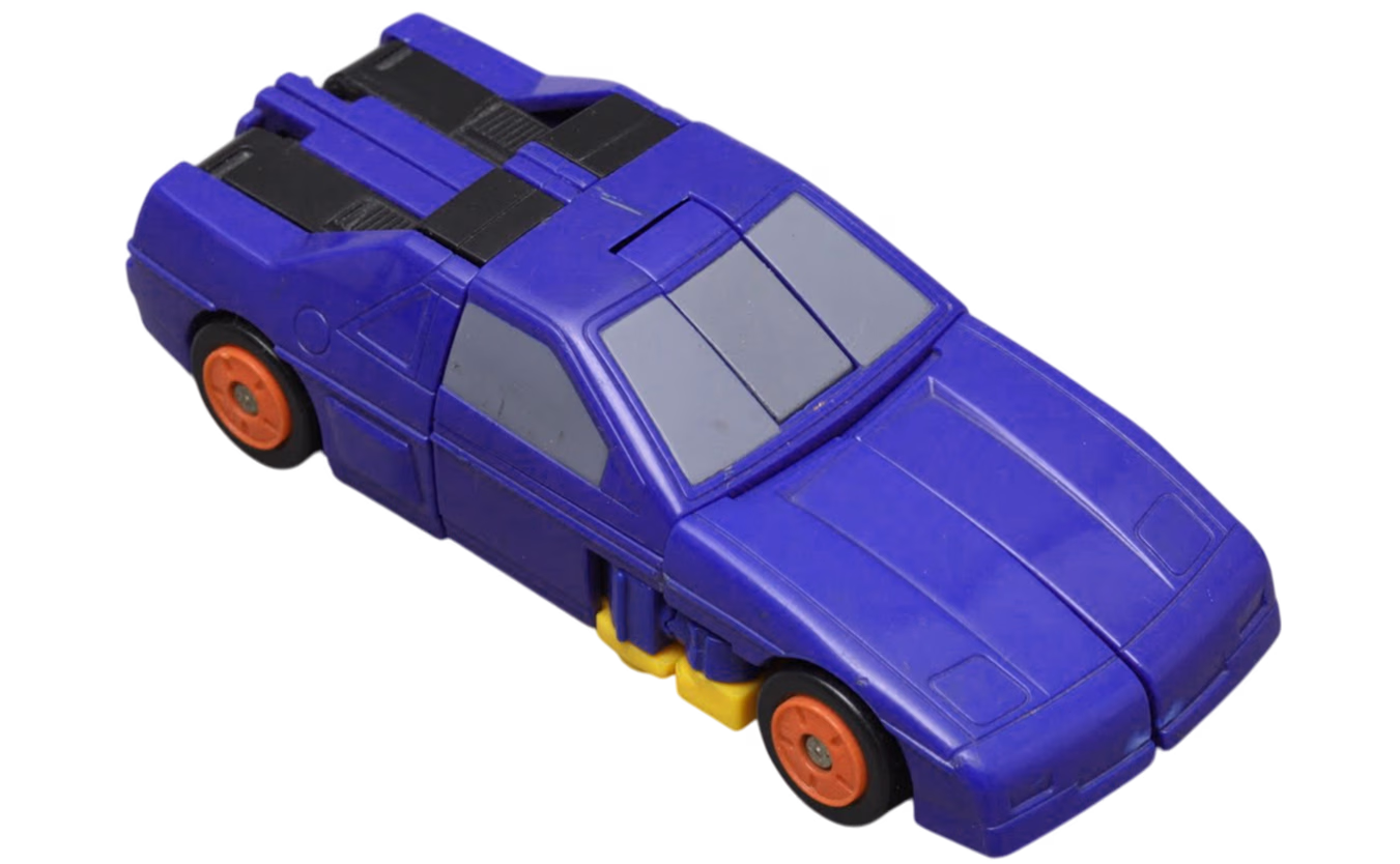 Синяя игрушечная машинка с оранжевыми колесами и видимыми желтыми компонентами снизу.